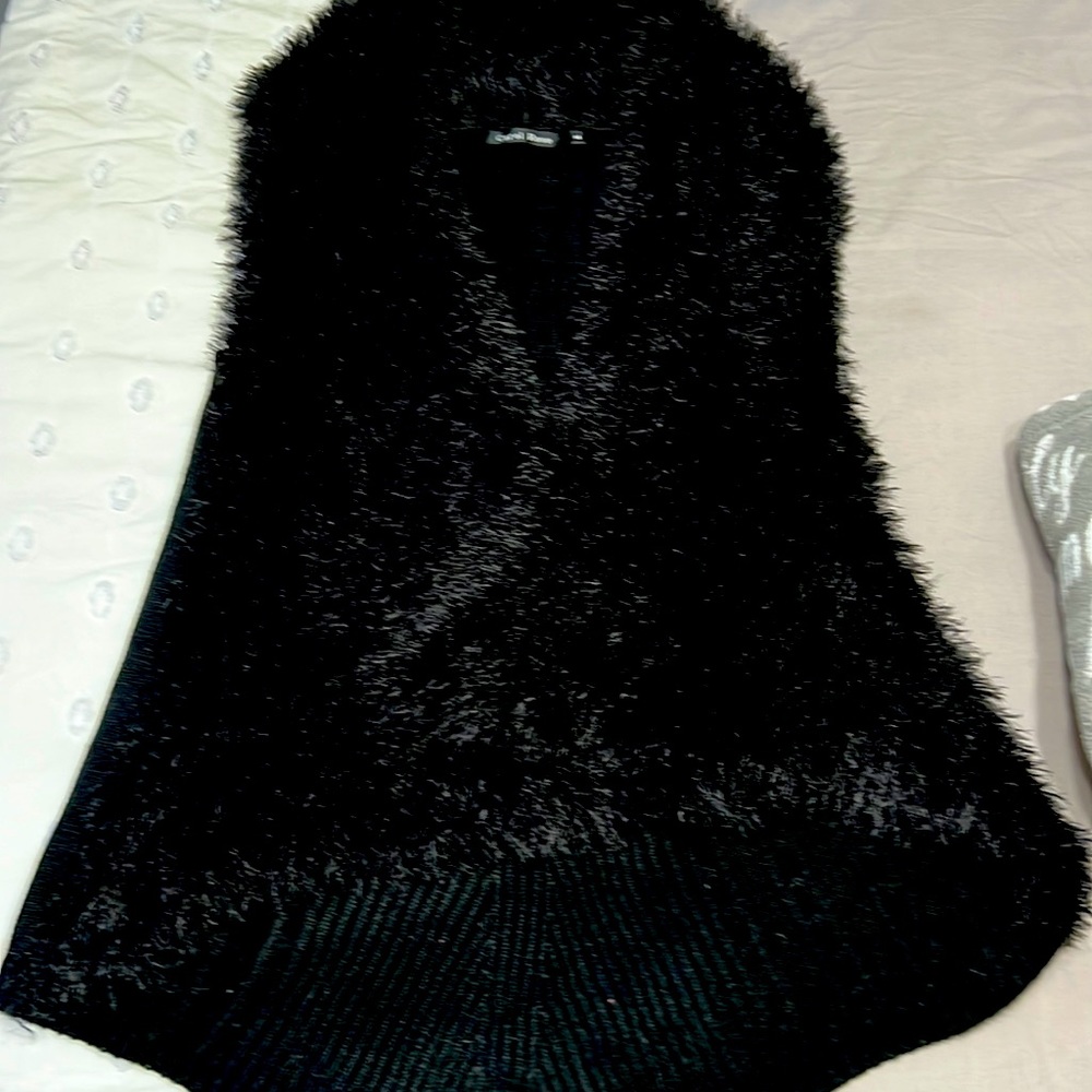 Beautiful cardigan vest.  Hangs below the hips comfortable light weight sweater.
